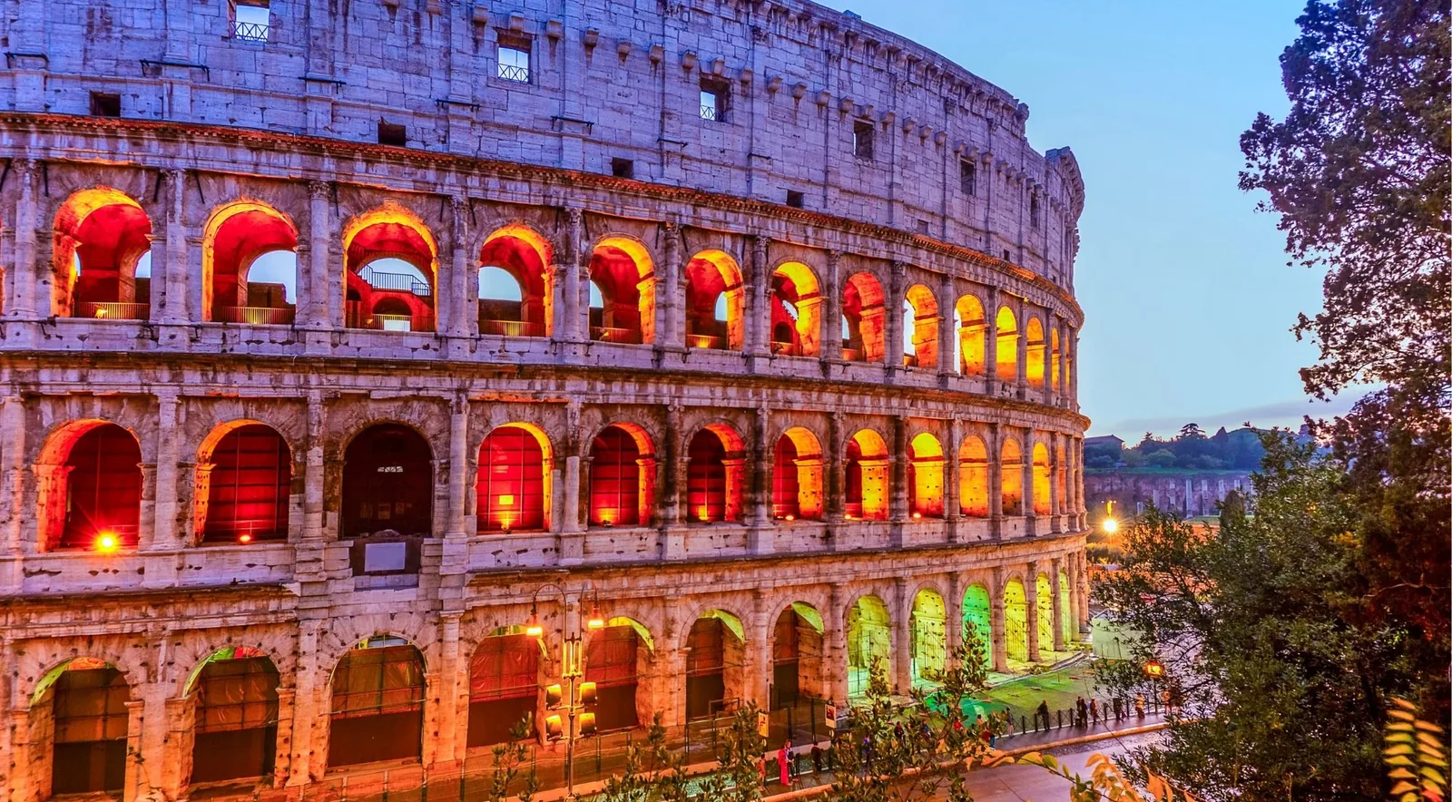 The Colosseum illuminated at night for an evening guided tour
