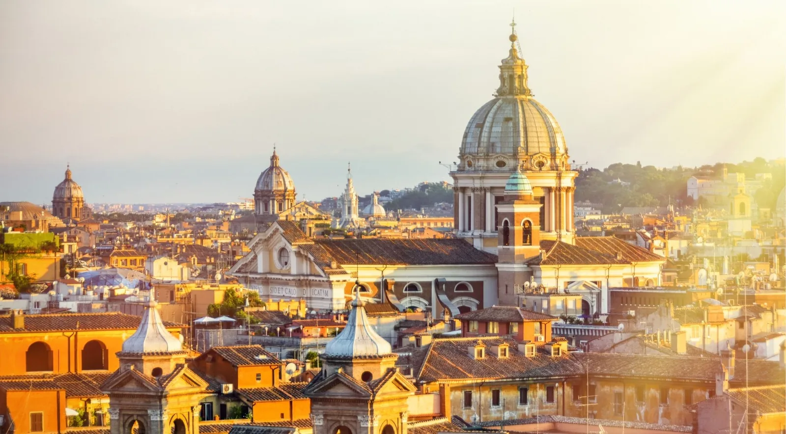 Rome's rooftops and church domes at golden hour — the anchor image for a 3-day Rome itinerary